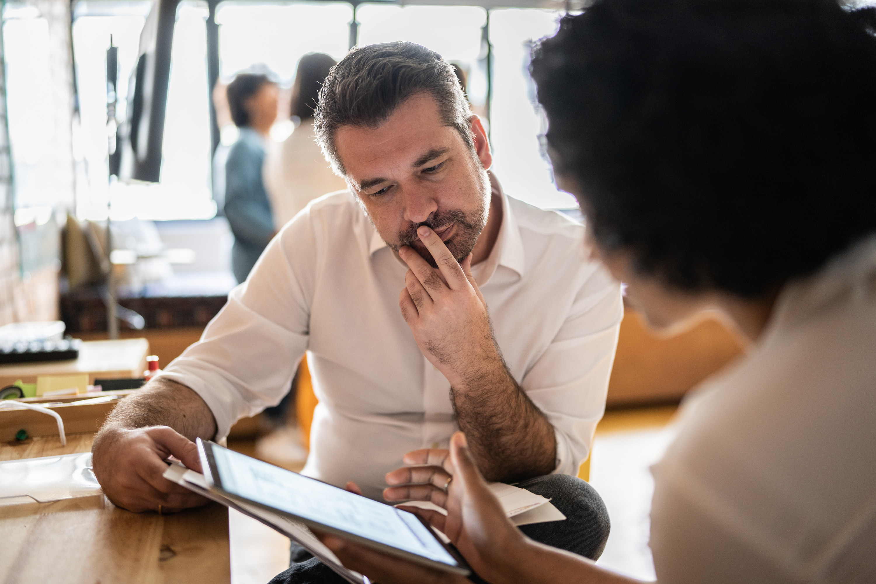 two people talking in an office