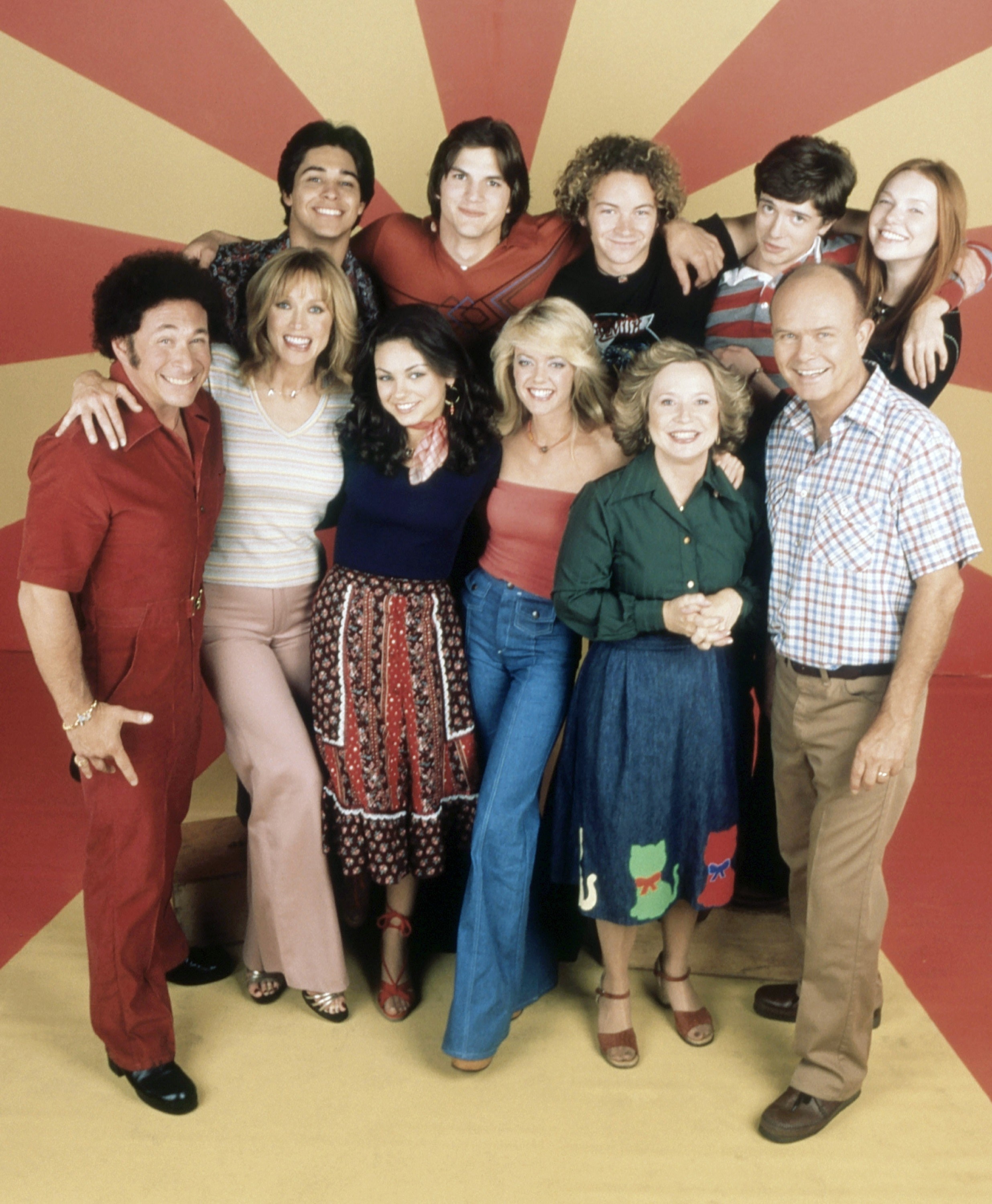 A group shot of the cast smiling
