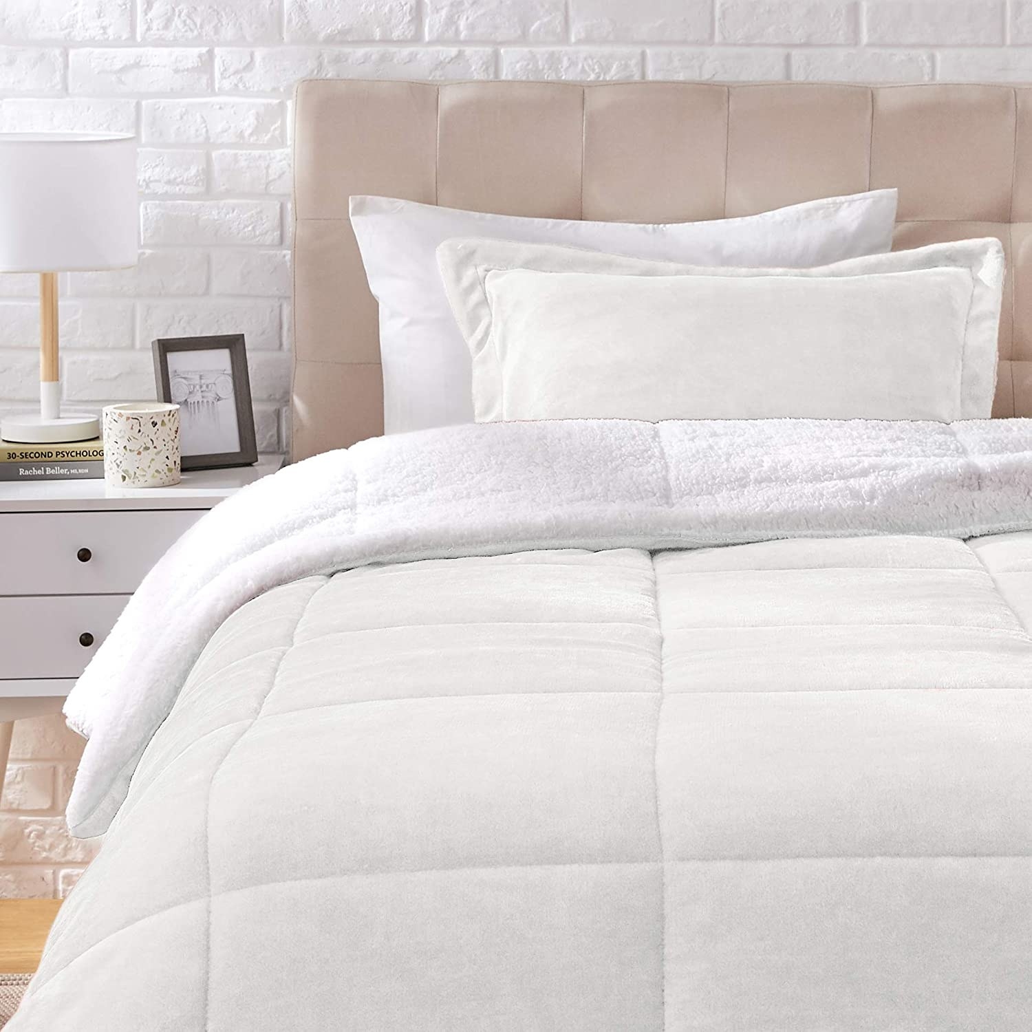 the fluffy comforter set on a bed