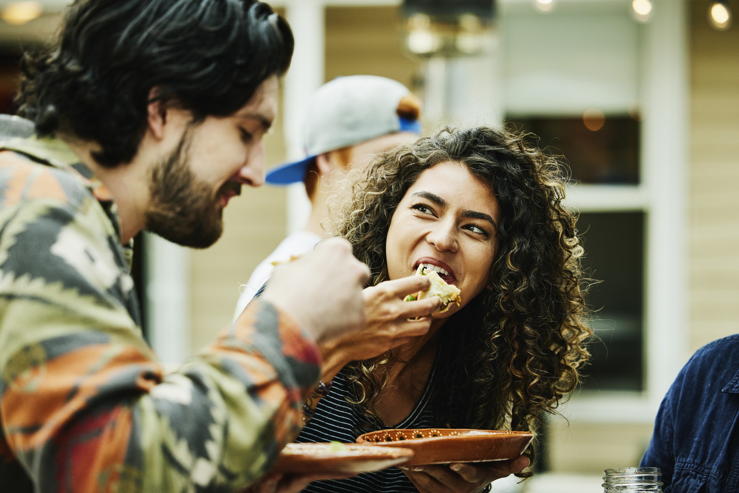 A man and a woman eating together