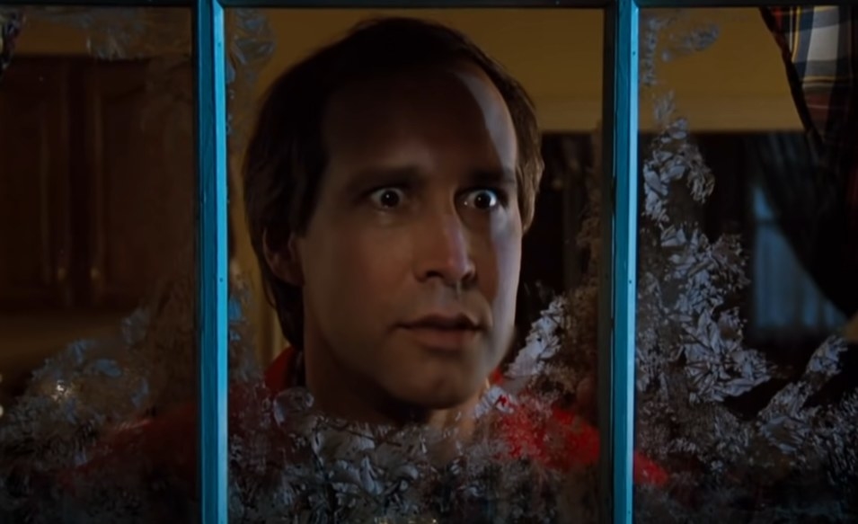 Chevy Chase as Clark looking outside his window as he has a fantasy about his pool