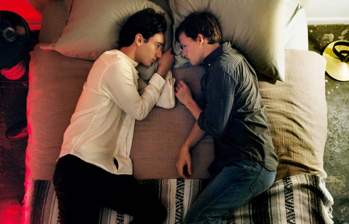 Theodore Pellerin and Lucas Hedges lie in bed together