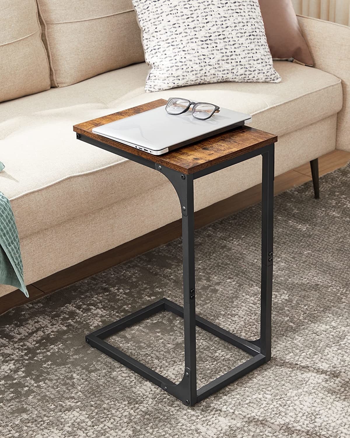 a side table with a laptop on it