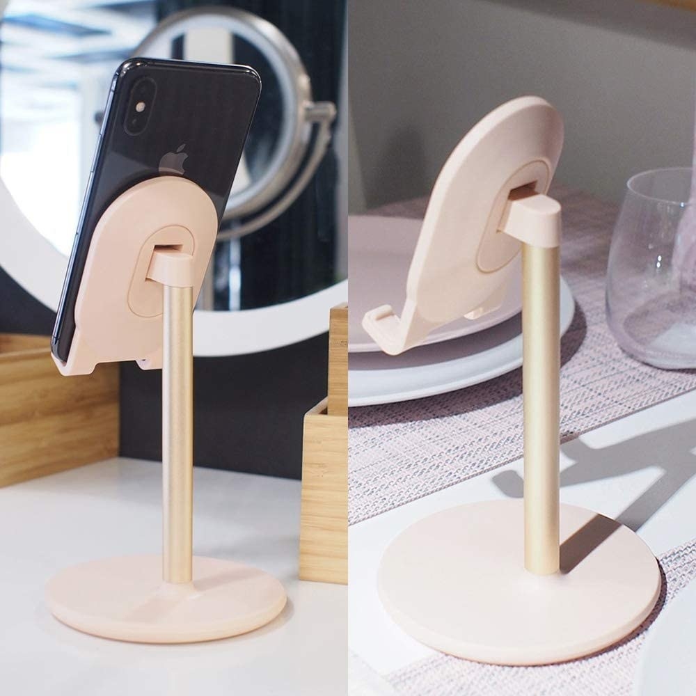 a cute phone holder holding a phone on a table