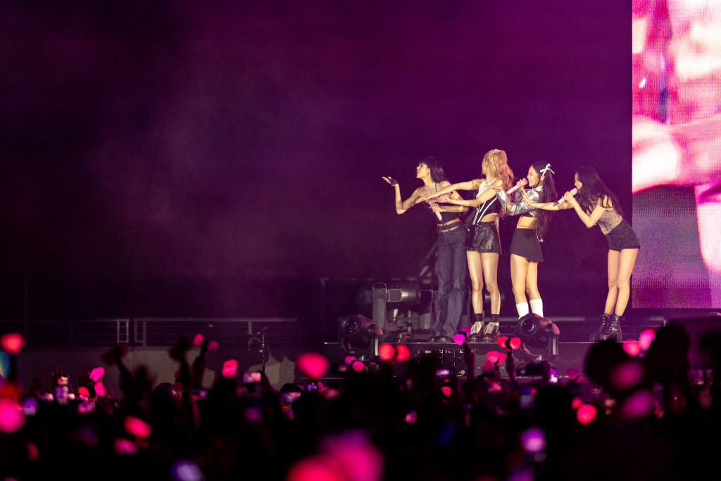 Jisoo, Jennie, Rosé and Lisa perform onstage in November 2022 in Los Angeles andblow kisses to the large crowd