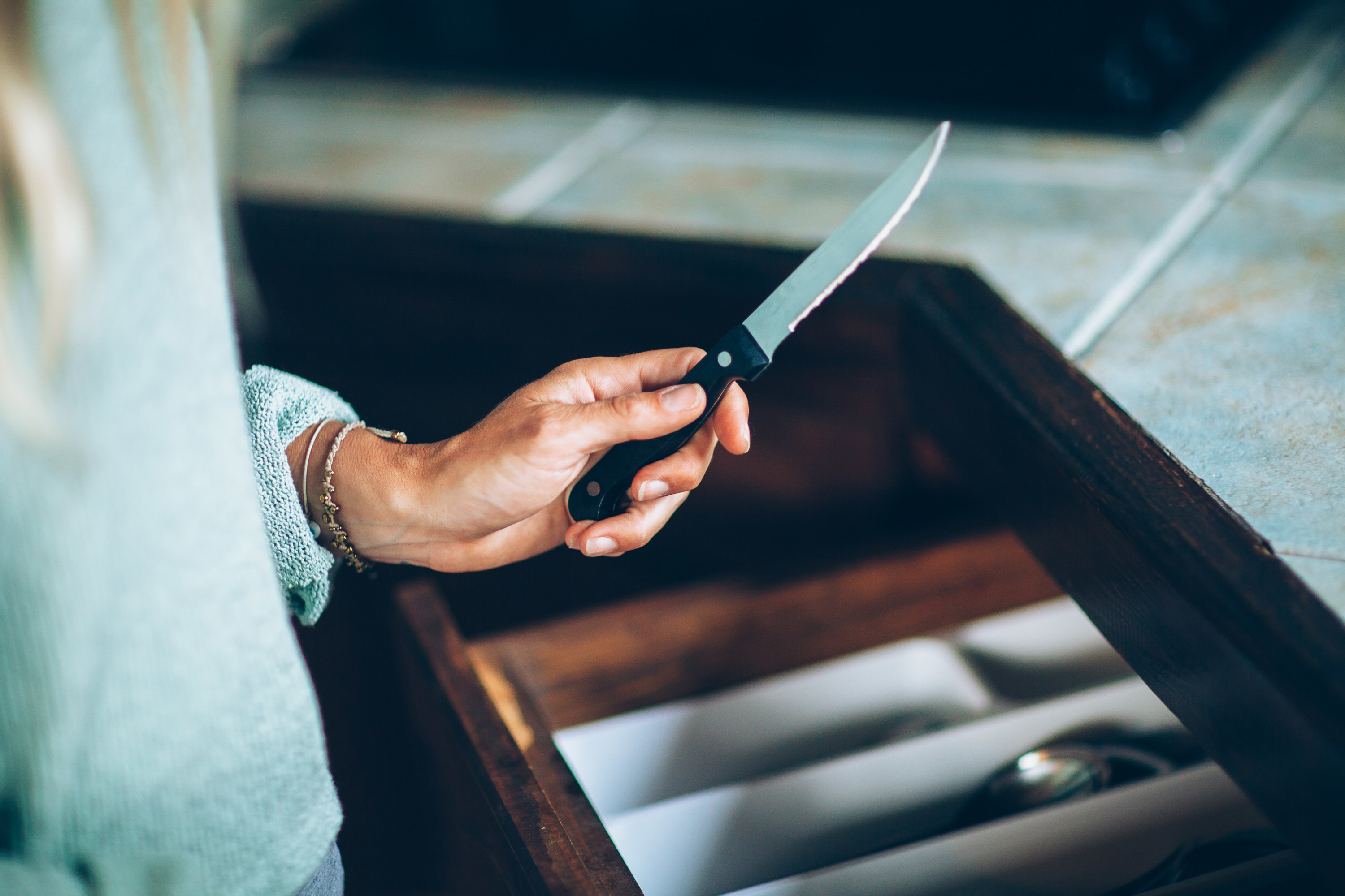 woman holding a kitchen knife