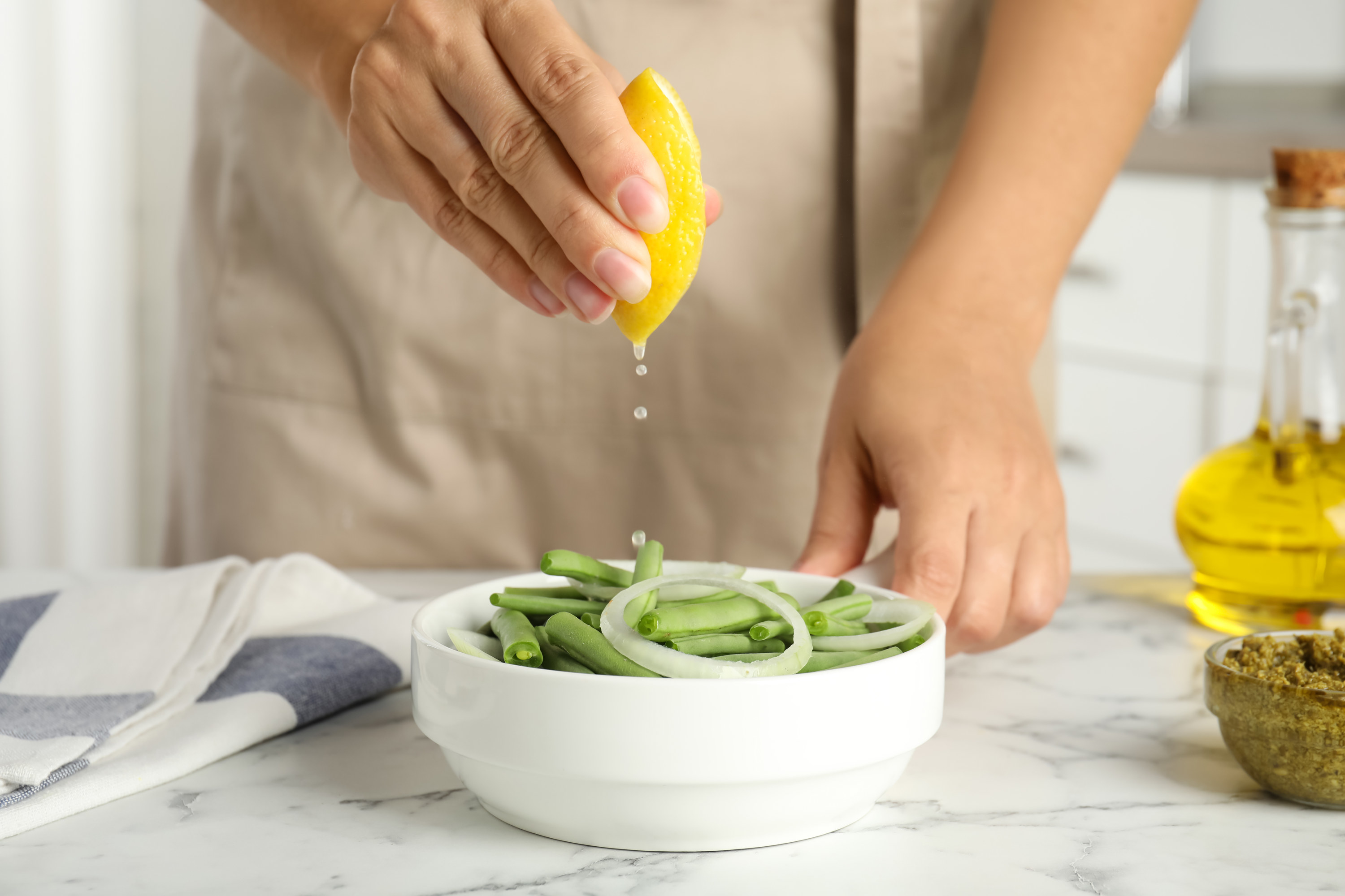 woman squeezing a lemon