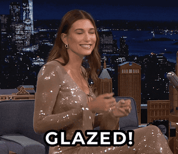 Hailey Bieber opening up hands and saying glazed
