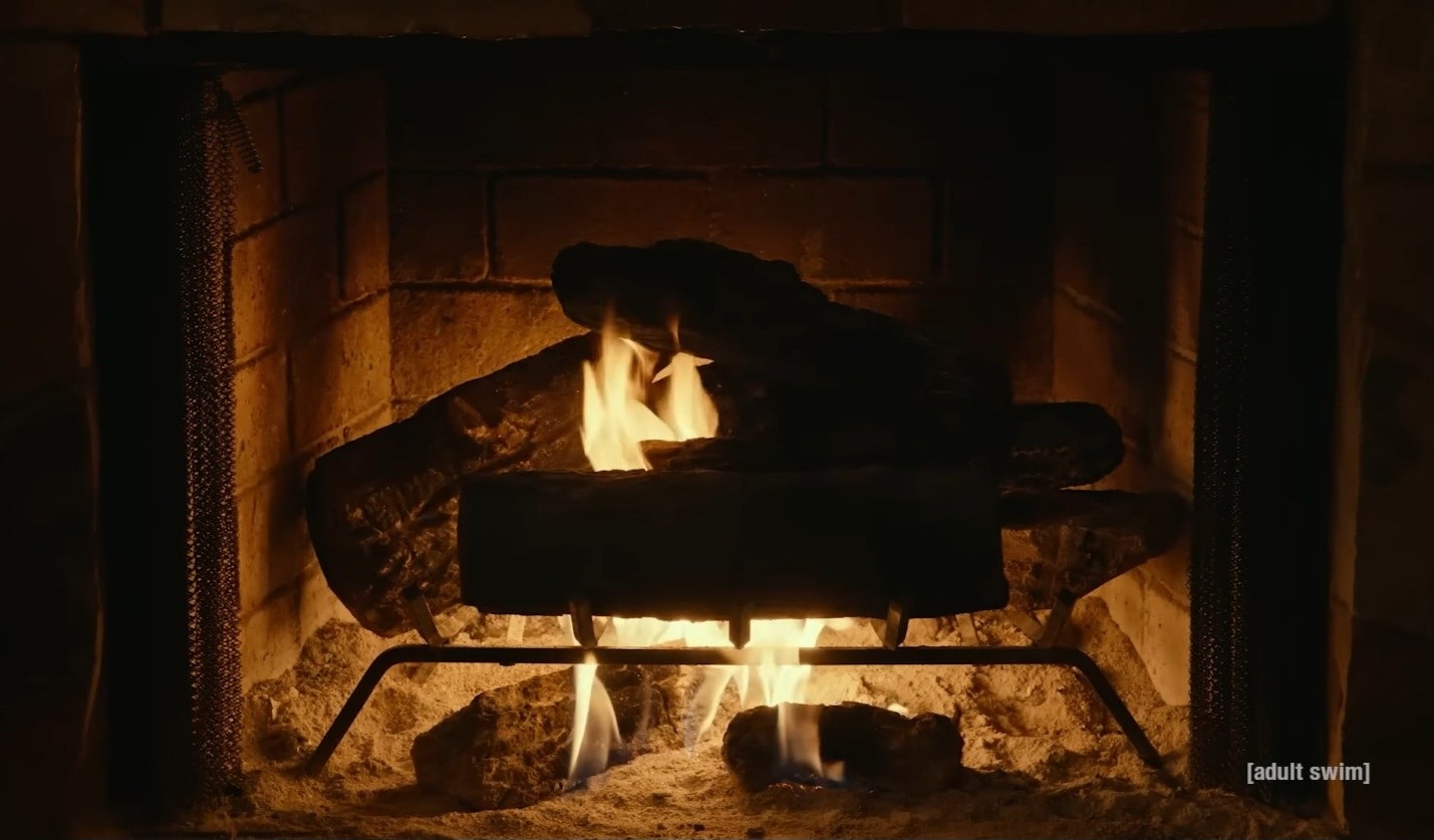 Logs roast in a seemingly ordinary fireplace