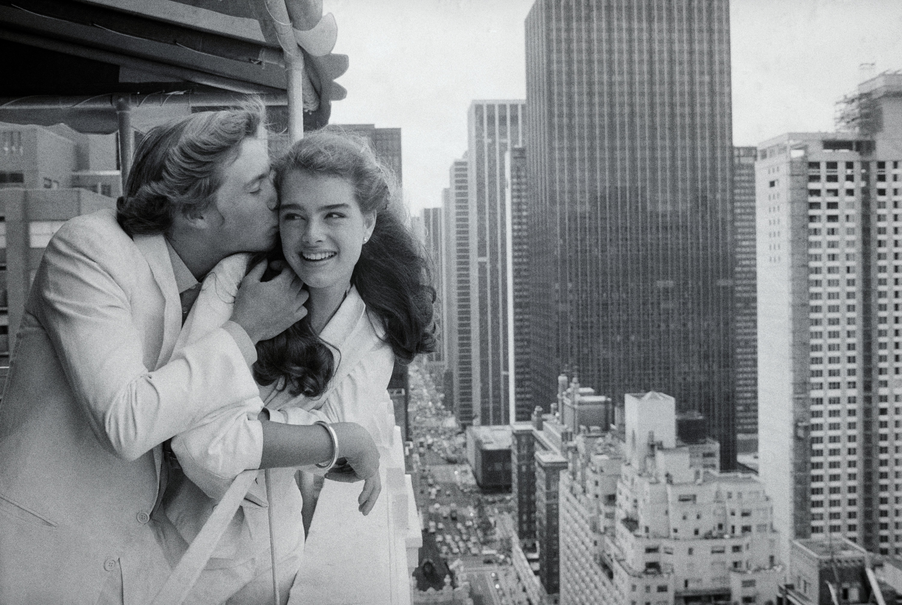 Christopher and Brooke on a high-rise balcony