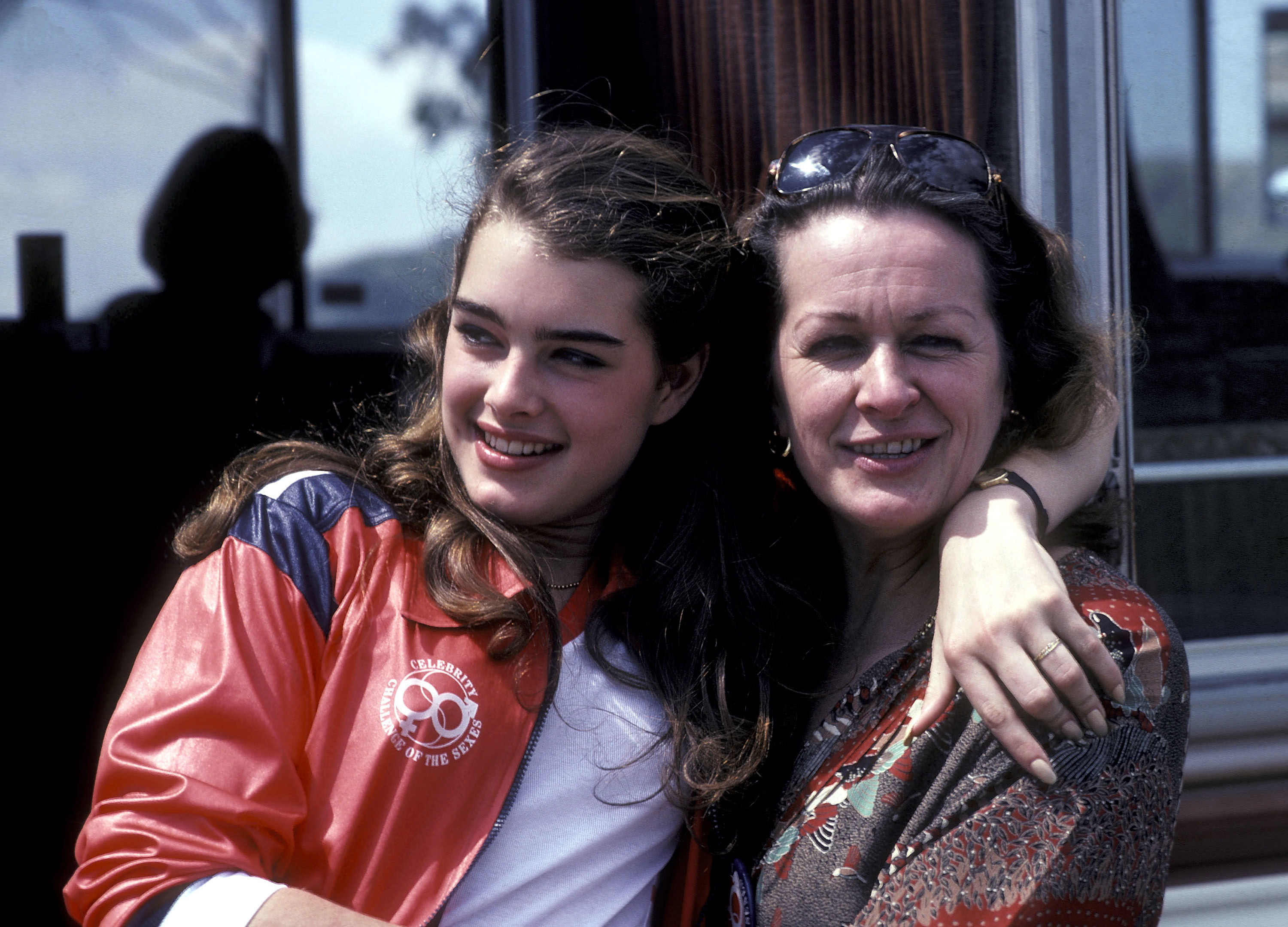 Brooke with her arm around her mom&#x27;s shoulders