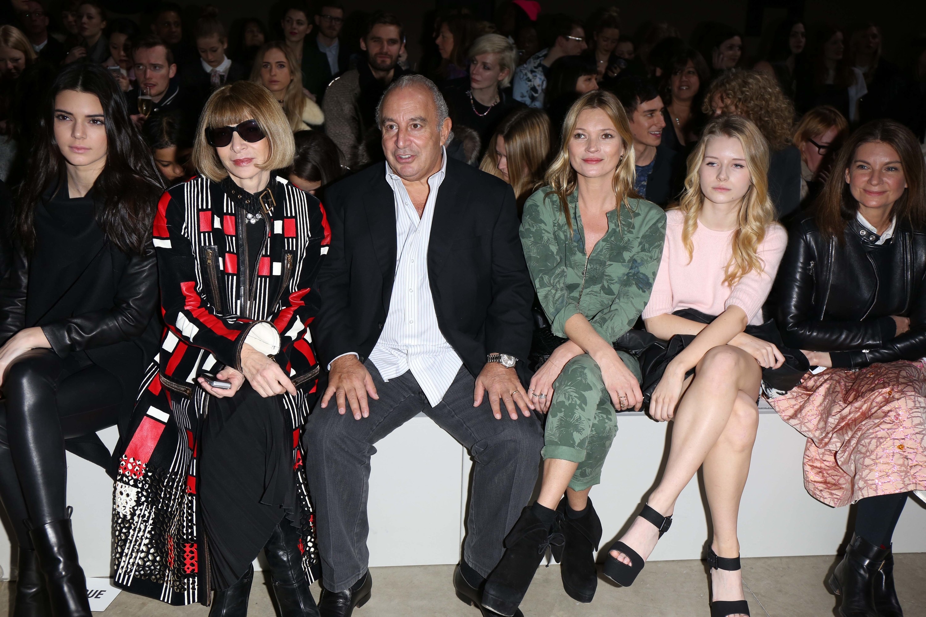 Lottie and Kate sitting with Anna Wintour and others at a fashion show