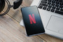 Photograph of Netflix logo on phone