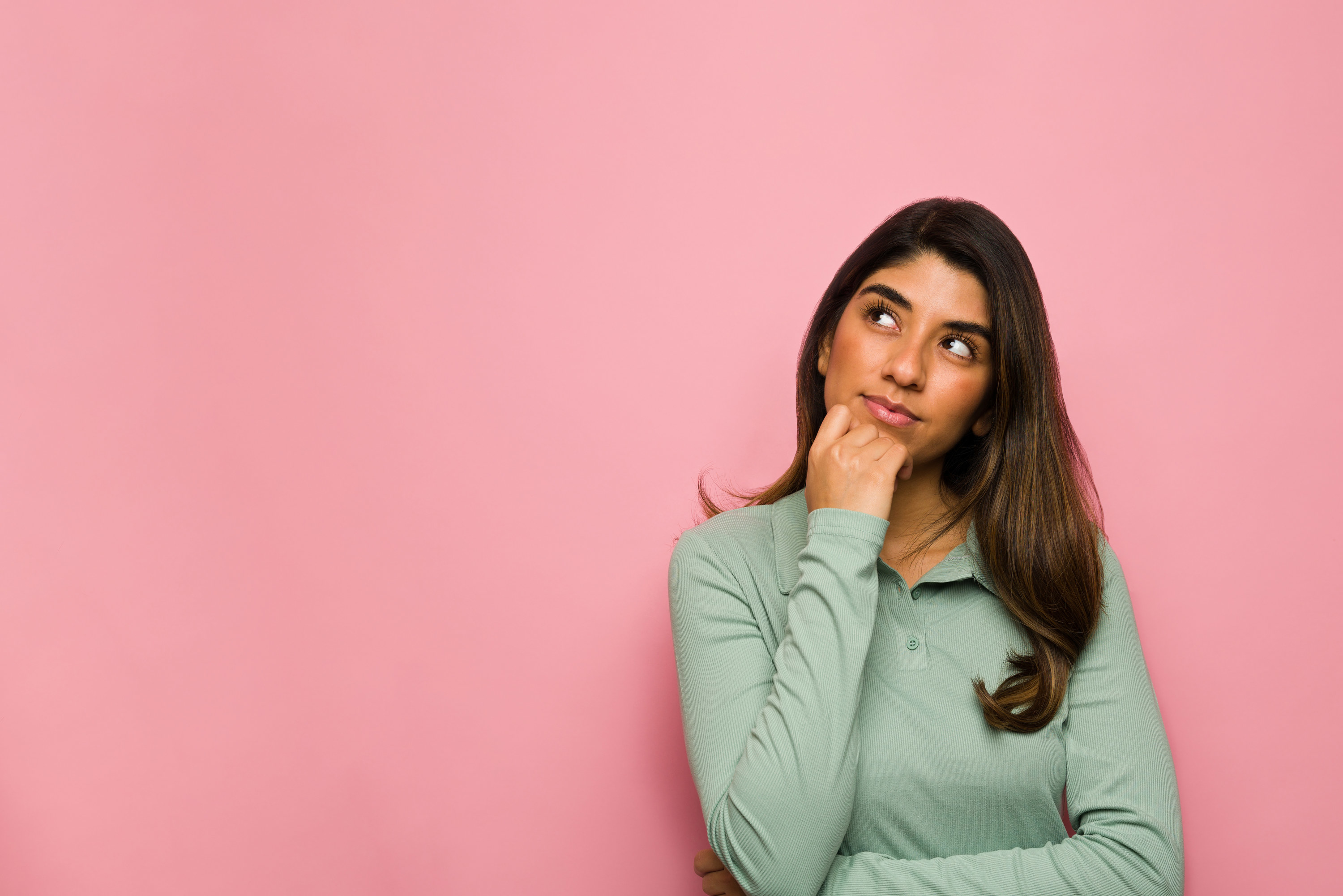 person looking thoughtful as if trying to make a decision