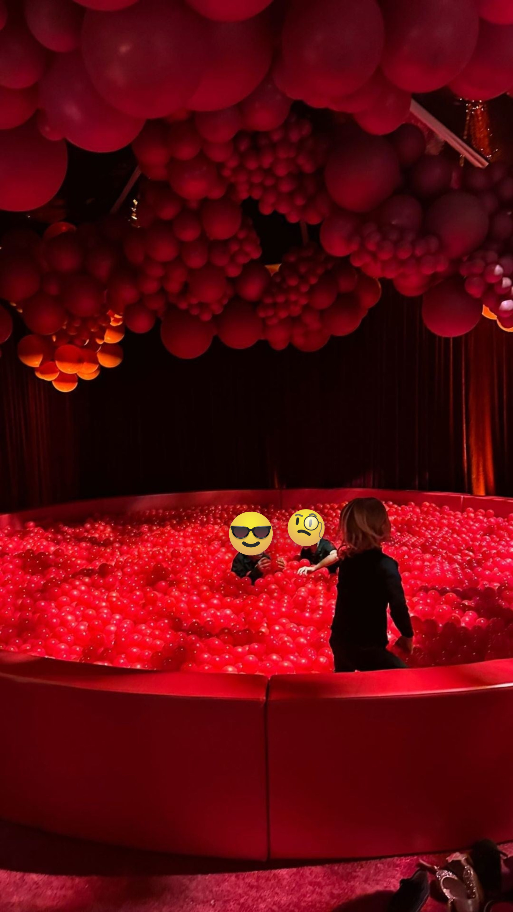 Children in a pit with many, many red balls