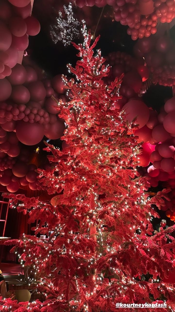 Large red tree with lights