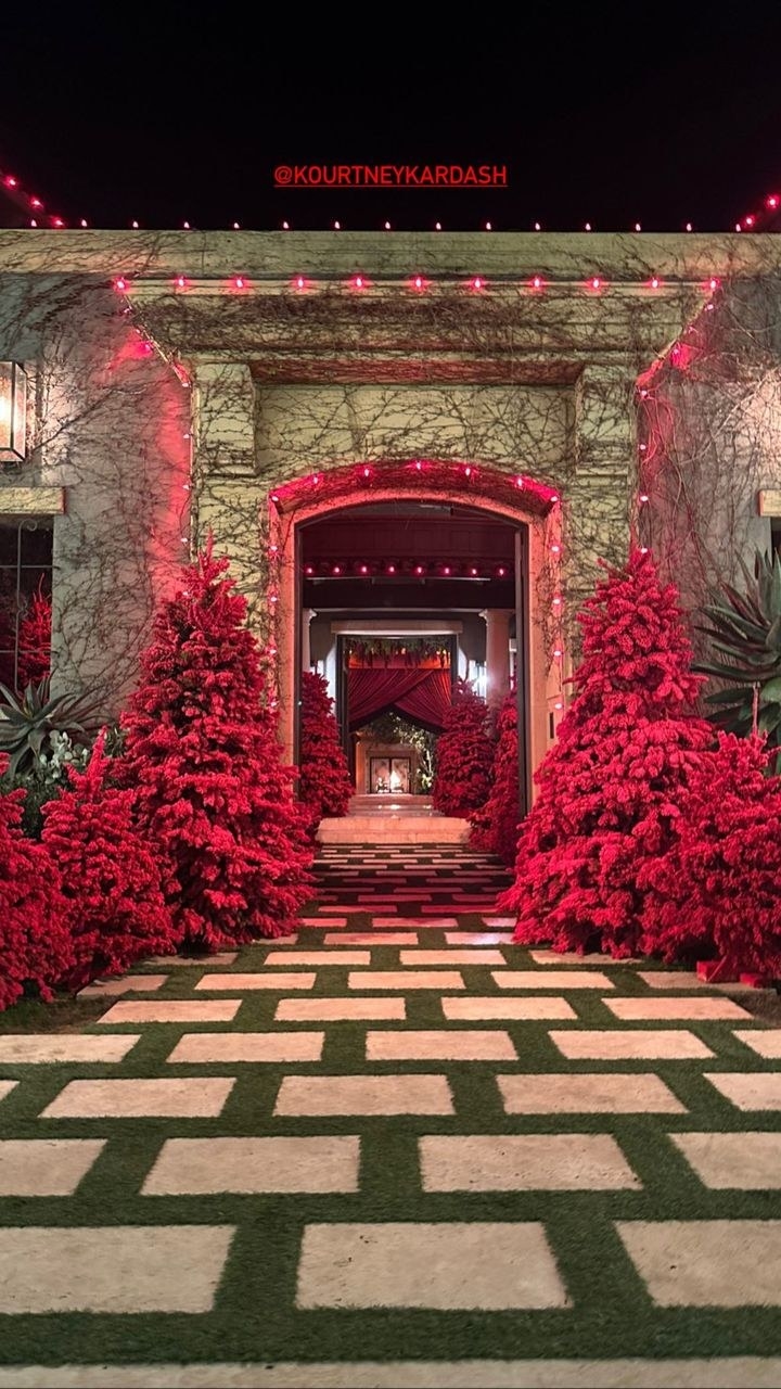 Red Xmas trees in a long hallway