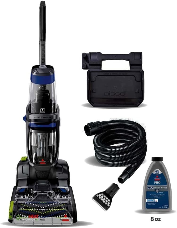 the carpet cleaner on a blank background with its hose attachment and bottle of cleaner