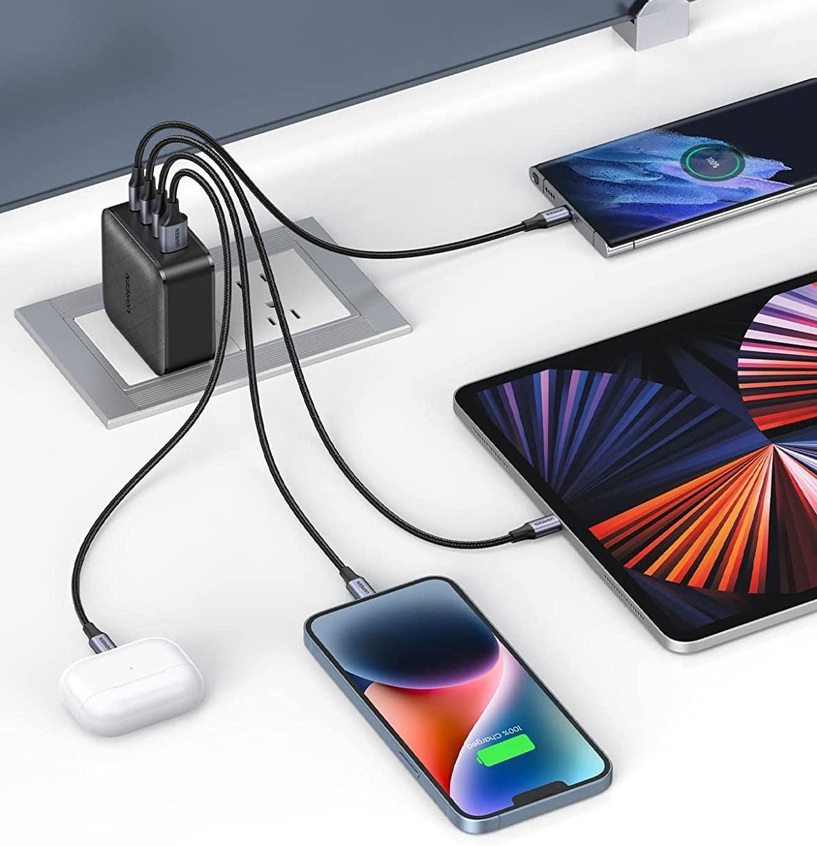 four devices being charged by the charging block