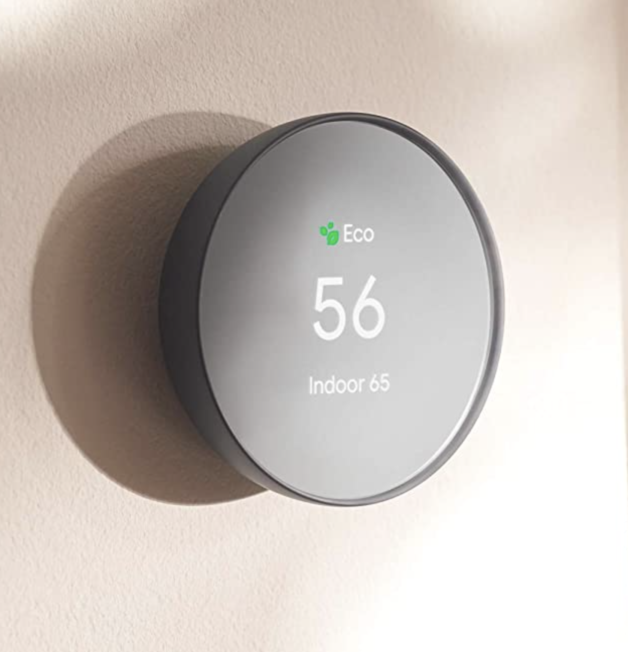 the smart thermostat on a wall