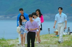 The cast of Single's Inferno walk down the beach
