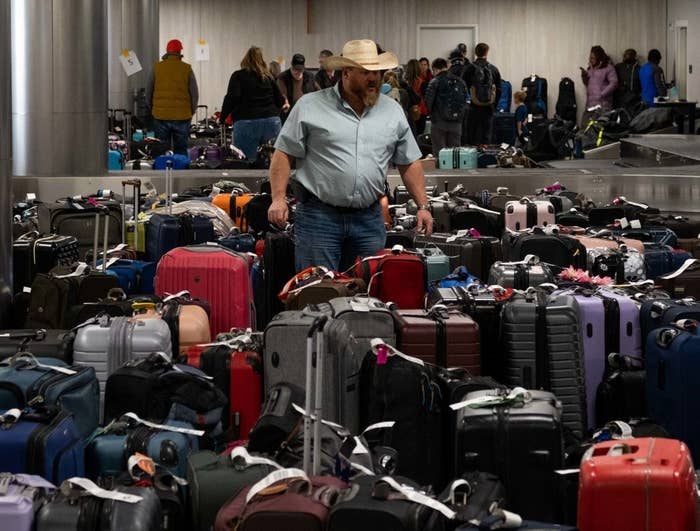 Man standing in a sea of luggage