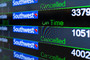 The arrivals and departures board displays canceled and delayed Southwest Airlines flights