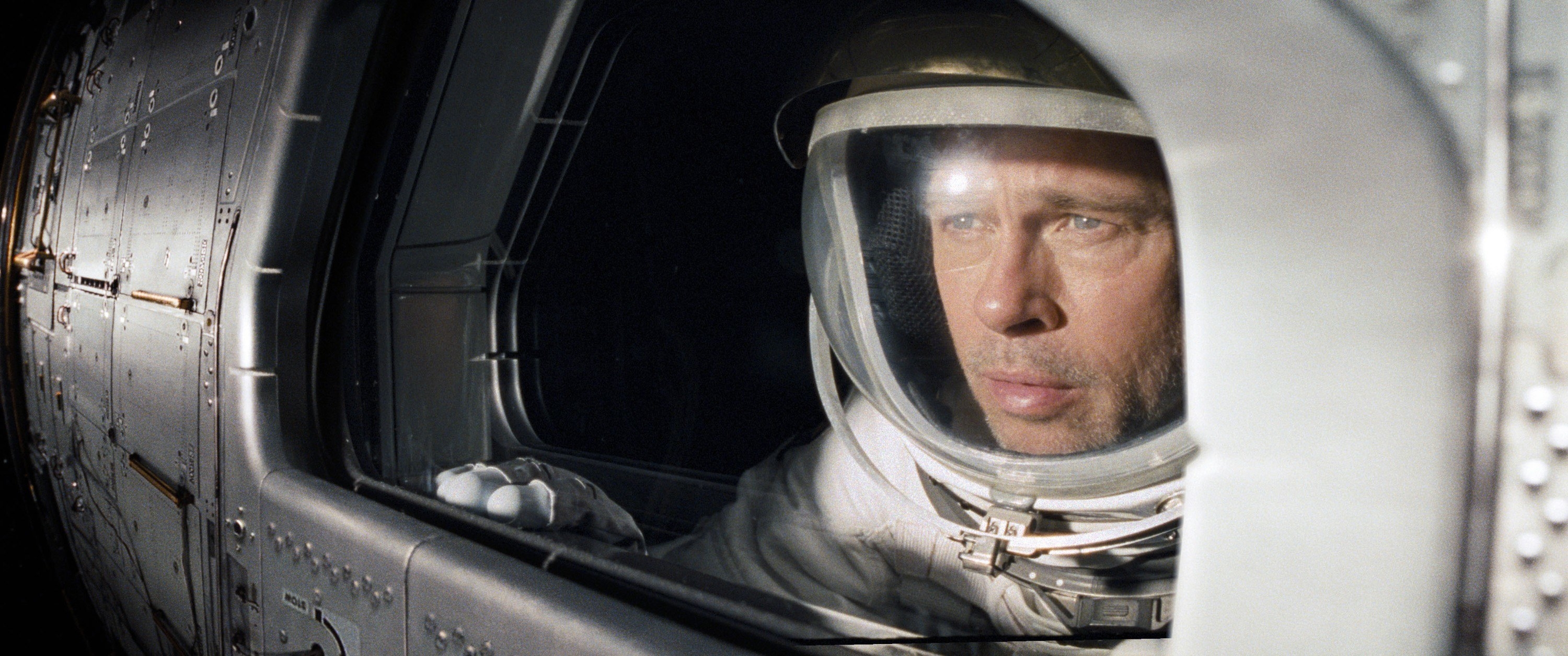 Man in an astronaut uniform in a spaceship