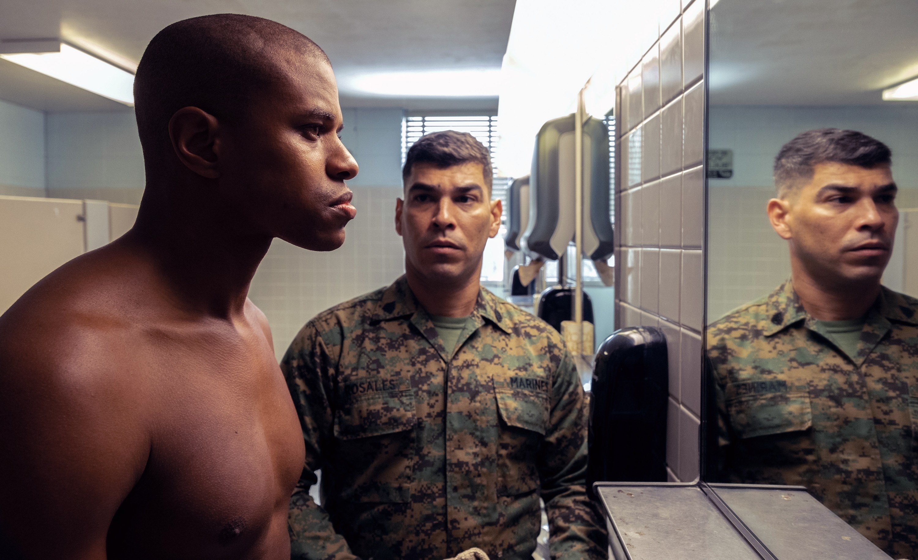 Jeremy looking in the mirror in a military scene