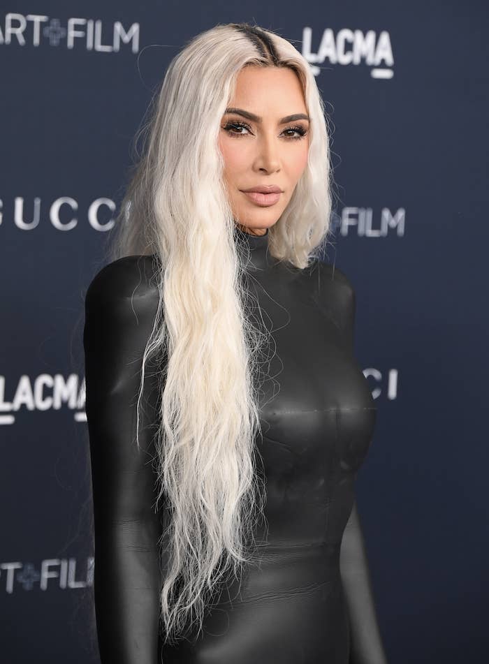 closeup of Kim with platinum blonde hair and dark roots showing