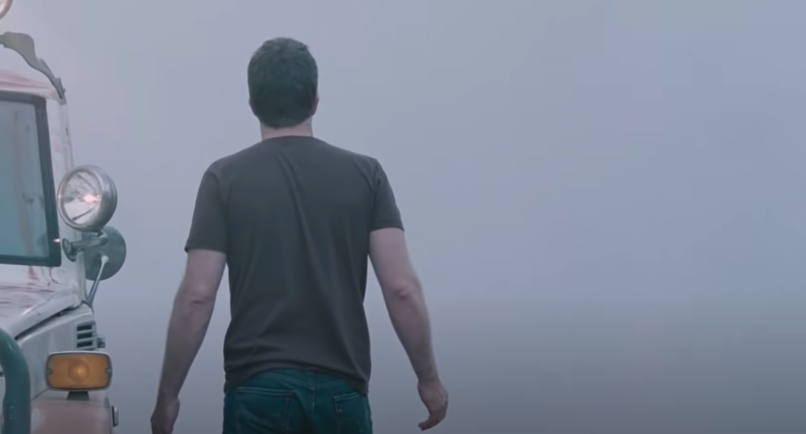 A man stares into mist