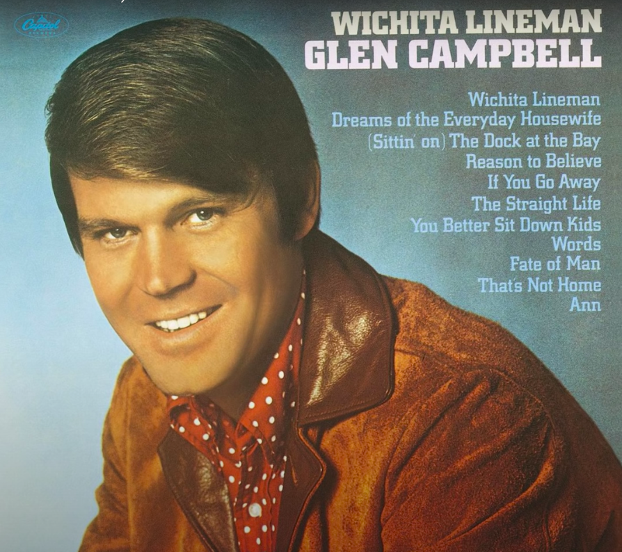 The album cover art, which consists of a man smiling at the camera