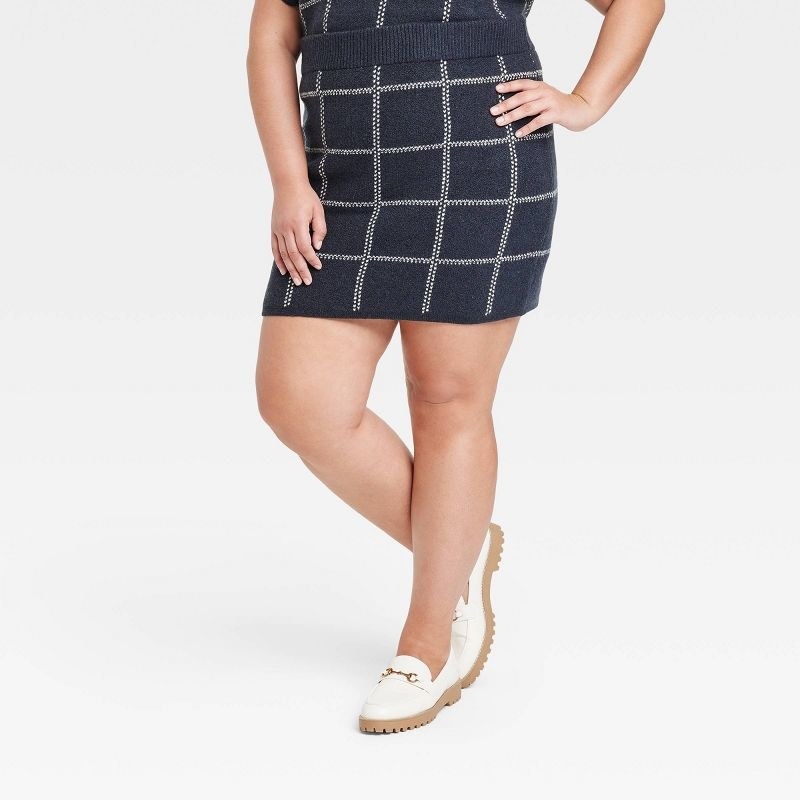 Model wearing the navy blue skirt