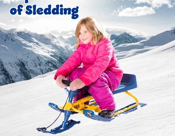 Girl riding sled in snow
