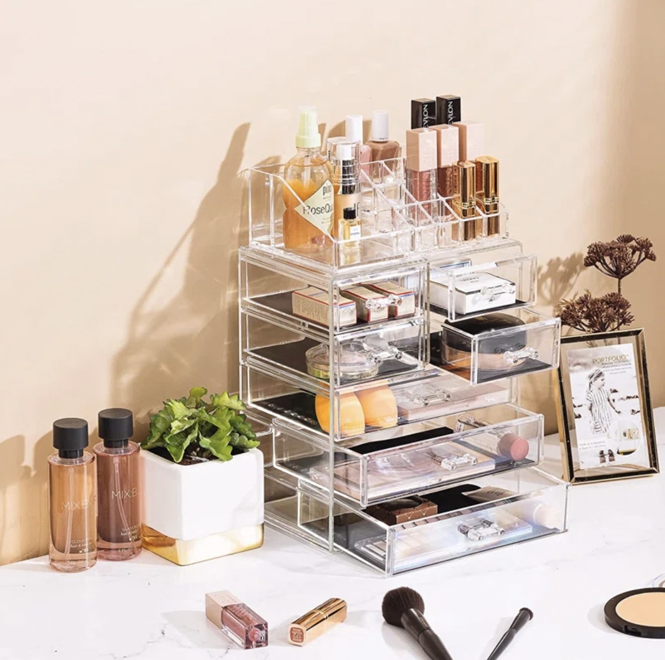 the clear makeup organizer with cosmetics inside