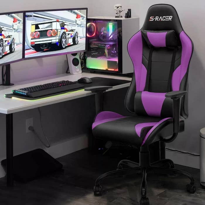 Black and purple chair in front of a desk and computer
