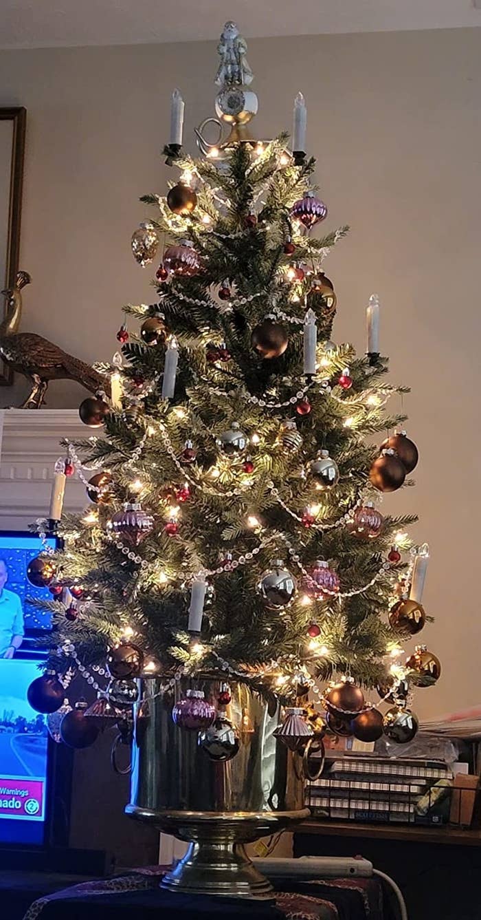 Reviewer&#x27;s tree decorated with ornaments on the table
