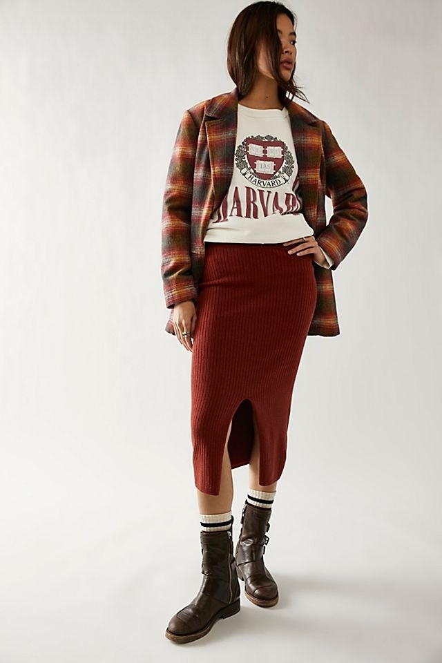 Model wearing the rust red skirt