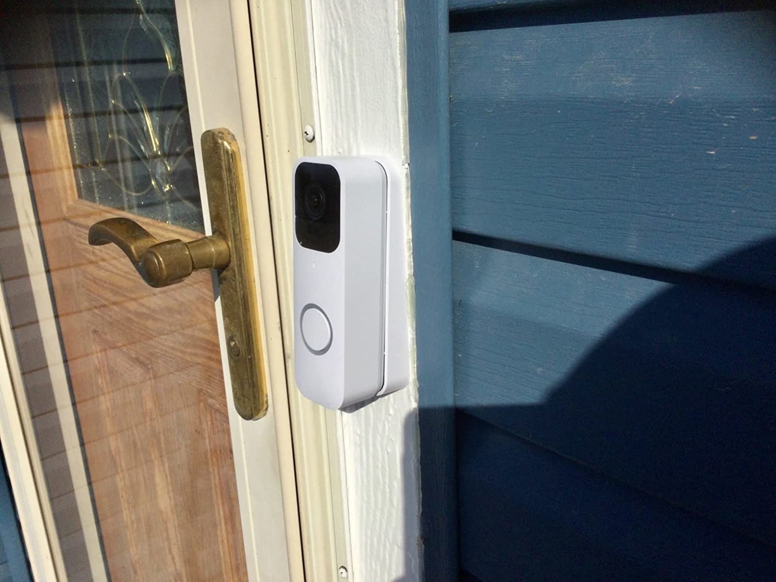 Reviewer&#x27;s photo of the white doorbell mounted on front door