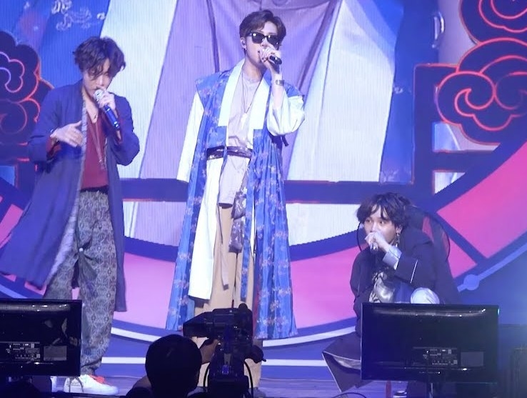 J-hope, RM, and Suga perform on stage wearing hanboks