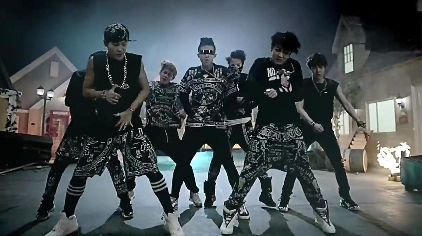 A screenshot of BTS dancing in the &quot;No More Dream&quot; music video