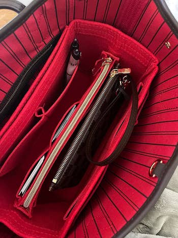 reviewer image of the red purse organizer inside of a large tote bag