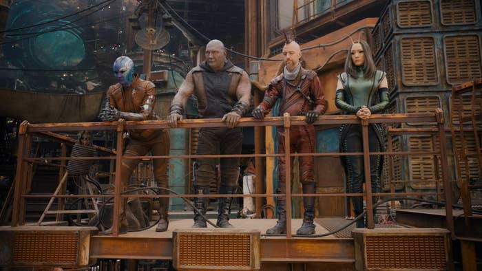 Nebula, Drax, Sean Gunn and Mantis talk while standing on a balcony