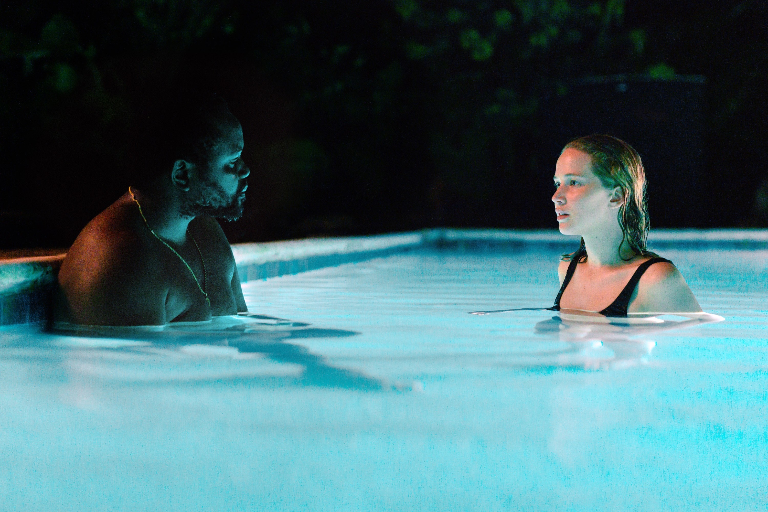 Brian Tyree Henry and Jennifer Lawrence talk in a swimming pool