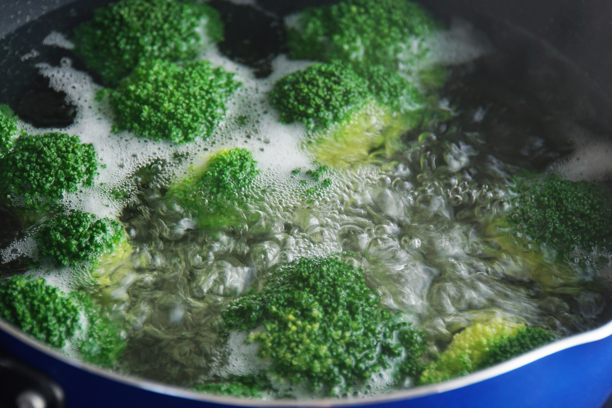 Broccoli boiling in water.
