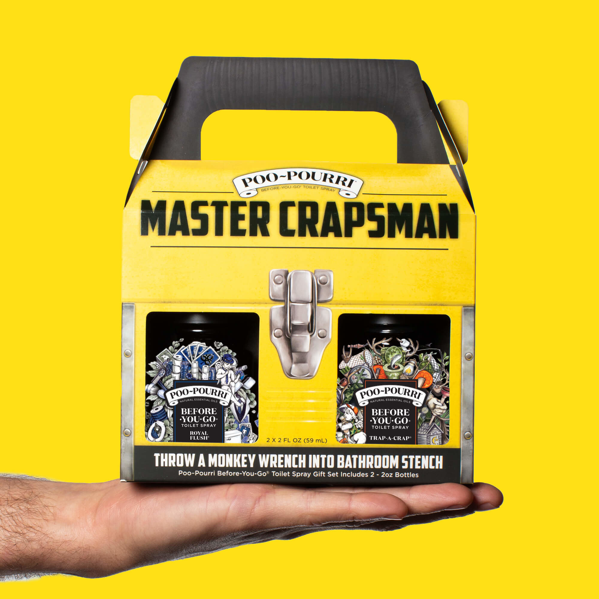 a person holding up the poo pourri master crapsman set in their hand