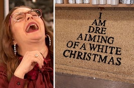 drew barrymore laughing next to a welcome mat reading "I am dre aiming of a white christmas"
