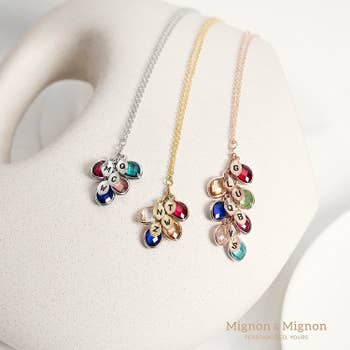 Three necklaces with various initials and birthstones