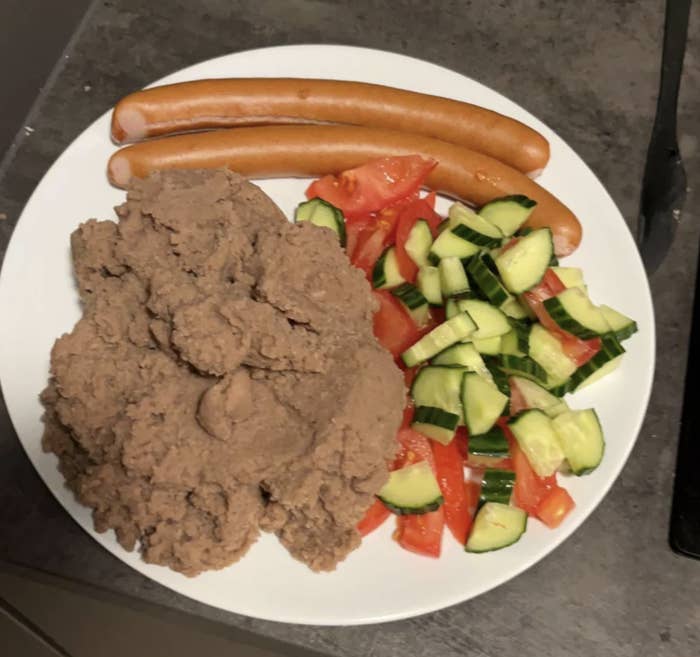 brown mashed potatoes with salad and sausage