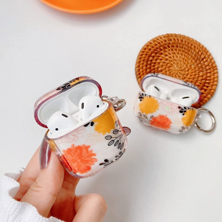 The AirPod case with an orange-y floral design